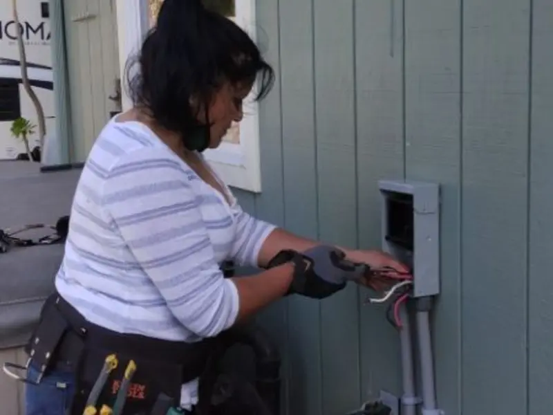 Licensed electrician wiring an exterior subpanel in Pullman