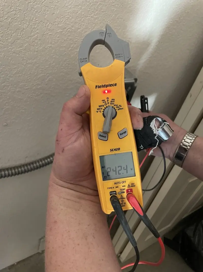 Voltage testing with clamp meter during Outlet Installation in Pullman